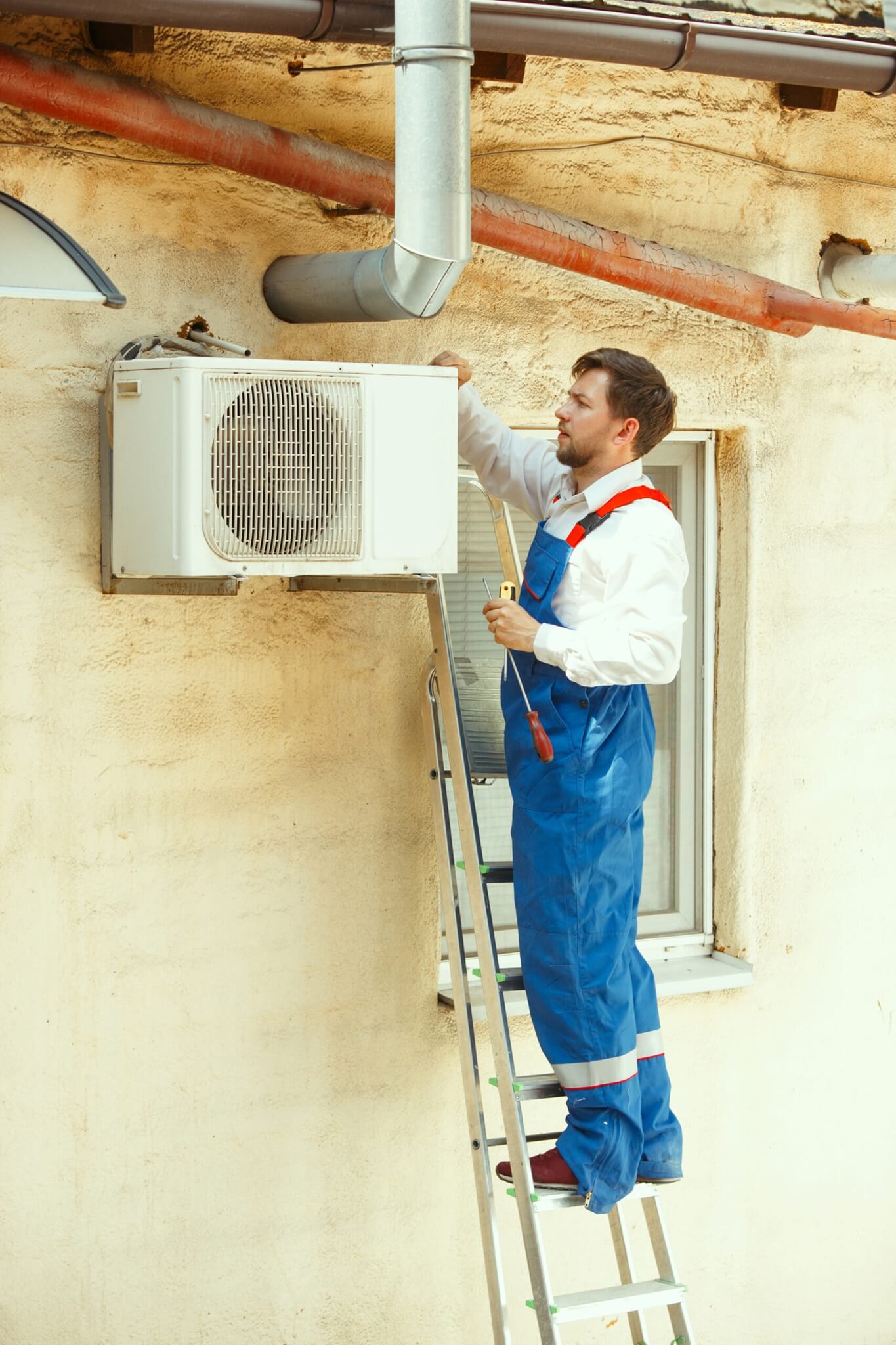 Technician repairing AC